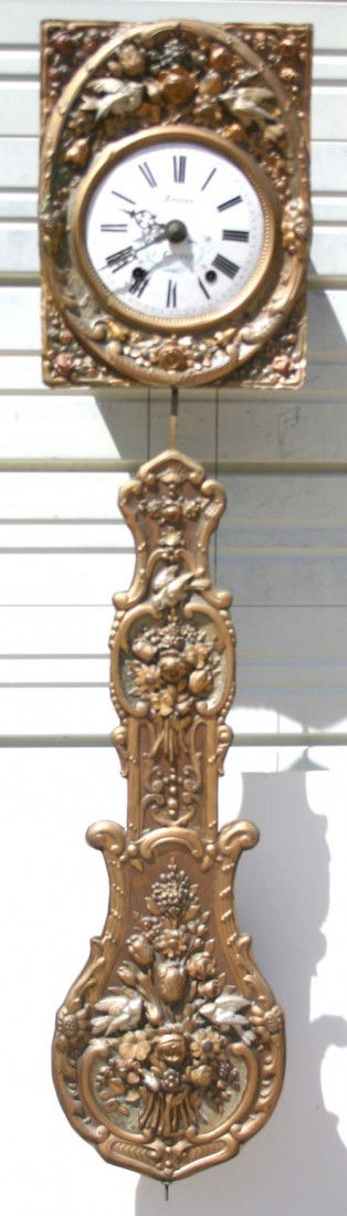 ornate heavily embossed brass French wag on the wa: ornate heavily embossed brass French wag on the wall clock marked "Besson A Cerizay" w traces of polychrome paint - 57" long