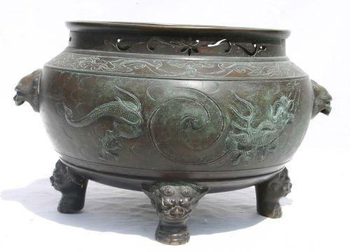 large Chinese bronze 4 ftd jardinere w Foo Dog han: large Chinese bronze 4 ftd jardinere w Foo Dog handles & feet & raised dragon dec - 10 1/2" tall x 15" diam