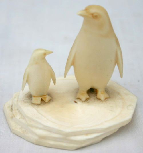 Carved whale tooth penguin sculpture - 2 1/8" tal: Carved whale tooth penguin sculpture - 2 1/8" tall on 2 1/2" diam platform