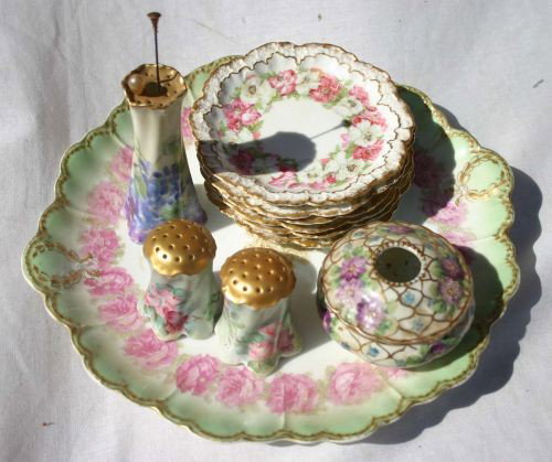 lot of very pretty French hand painted floral chin: lot of very pretty French hand painted floral china incl 6 matching dessert plates, hair receiver, hat pin holder, salt & peppers & a 12" cake plate