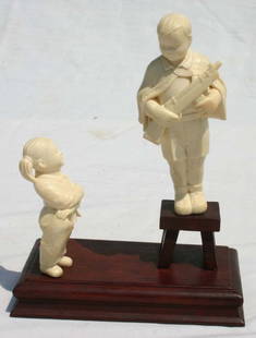 Outstanding orig boxed Chinese Cultural Revolution: Outstanding orig boxed Chinese Cultural Revolution carved ivory figural group depicting a boy w his father's gun & uniform & his little sister holding a picture of their father with that gun & uniform