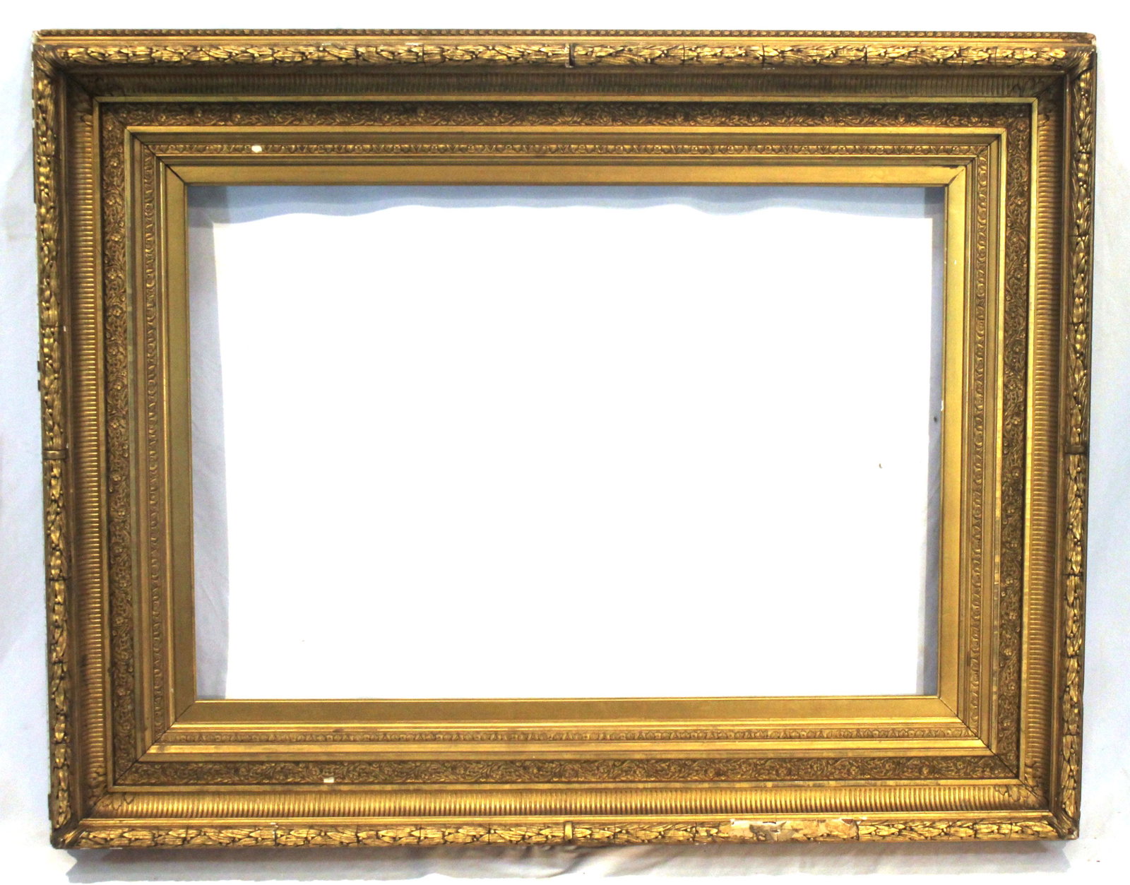 Oversized carved gold frame - as found - overall size 49" x 30 1/2" - interior is approx 36"x24": Oversized carved gold frame - as found - overall size 49" x 30 1/2" - interior is approx 36"x24"