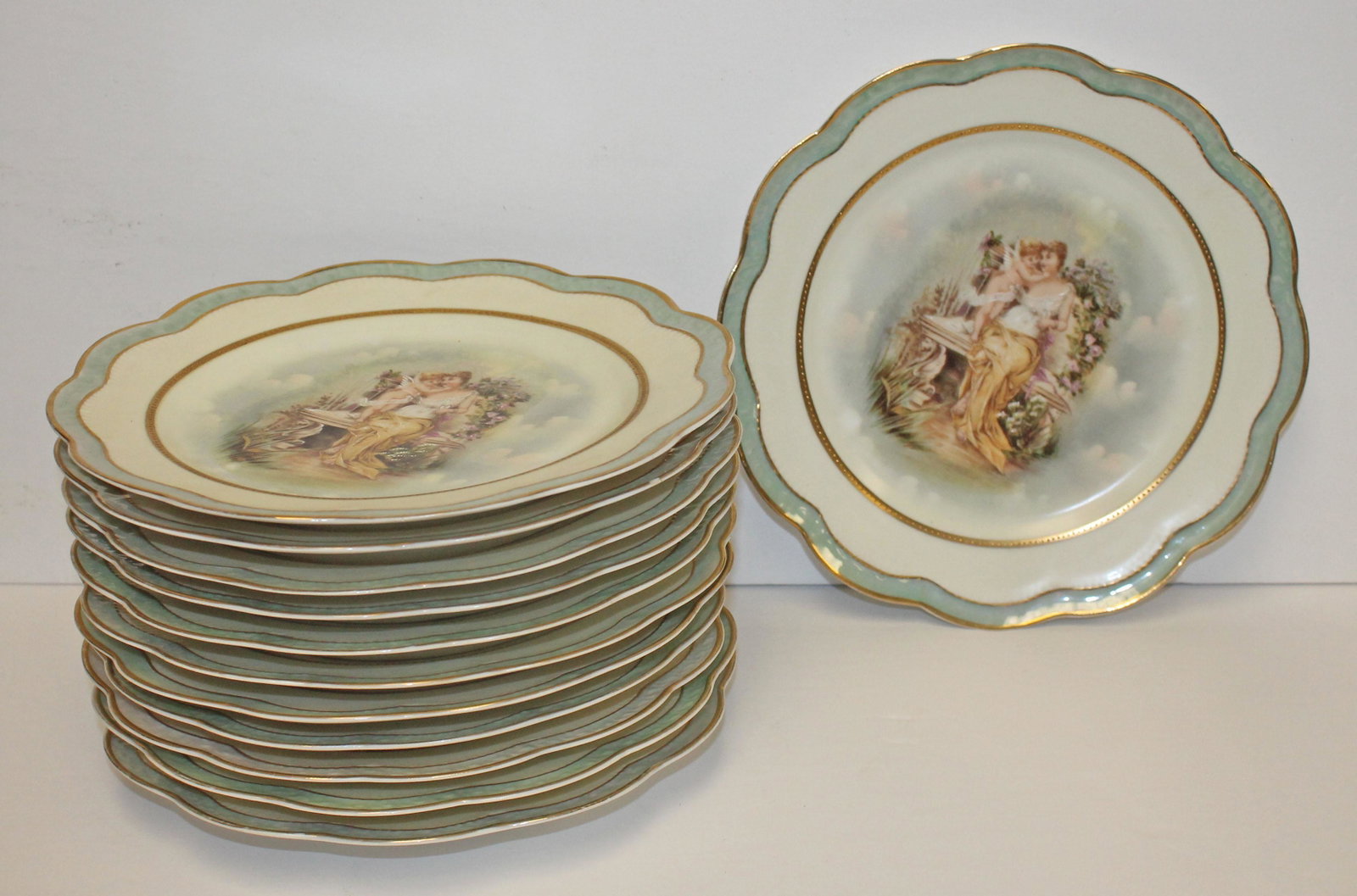 Set of 12 hand painted 8 1/2" scalloped shaped dishes w 3 different scenes of Classical woman w: Set of 12 hand painted 8 1/2" scalloped shaped dishes w 3 different scenes of Classical woman w cherubs