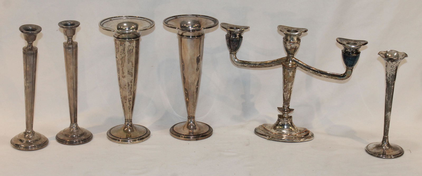 Lot of 6 Sterling silver pieces incl weighted pr of candlesticks, pr of bud vases (plus a single) & (1 of 9)