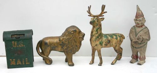 lot of 4 antique cast iron still banks - 6" clown,: lot of 4 antique cast iron still banks - 6" clown, 5" lion, 6" reindeer & 4" mailbox