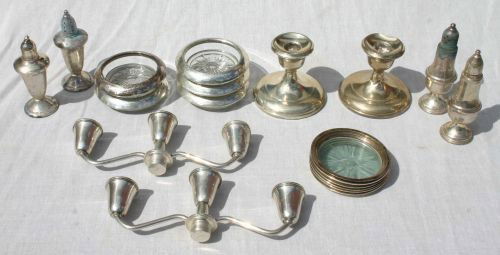 lot of sterling silver weighted items incl candles: lot of sterling silver weighted items incl candlesticks, salts & peppers, coasters, etc