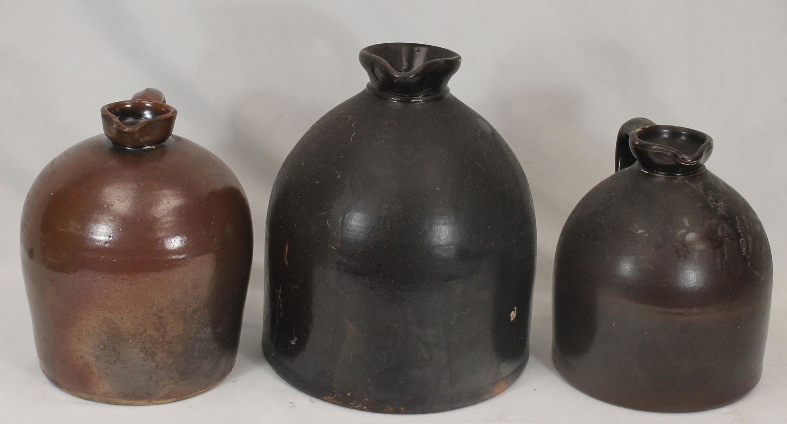 Lot of 3 antique stoneware pitchers in brown glaze - 9", 9 1/2" & 11 1/2" tall (1 of 10)