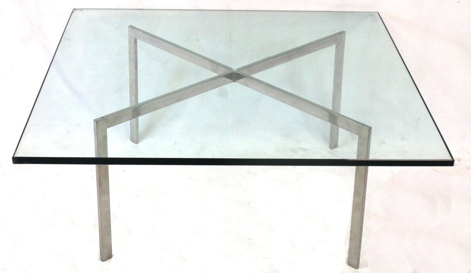 Knoll Barcelona Chrome and Glass Table with original 1964 receipt. From the Grosse Pointe Estate of: Knoll Barcelona Chrome and Glass Table with original 1964 receipt. From the Grosse Pointe Estate of John V. Sheoris - 40" square glass top x 17" tall