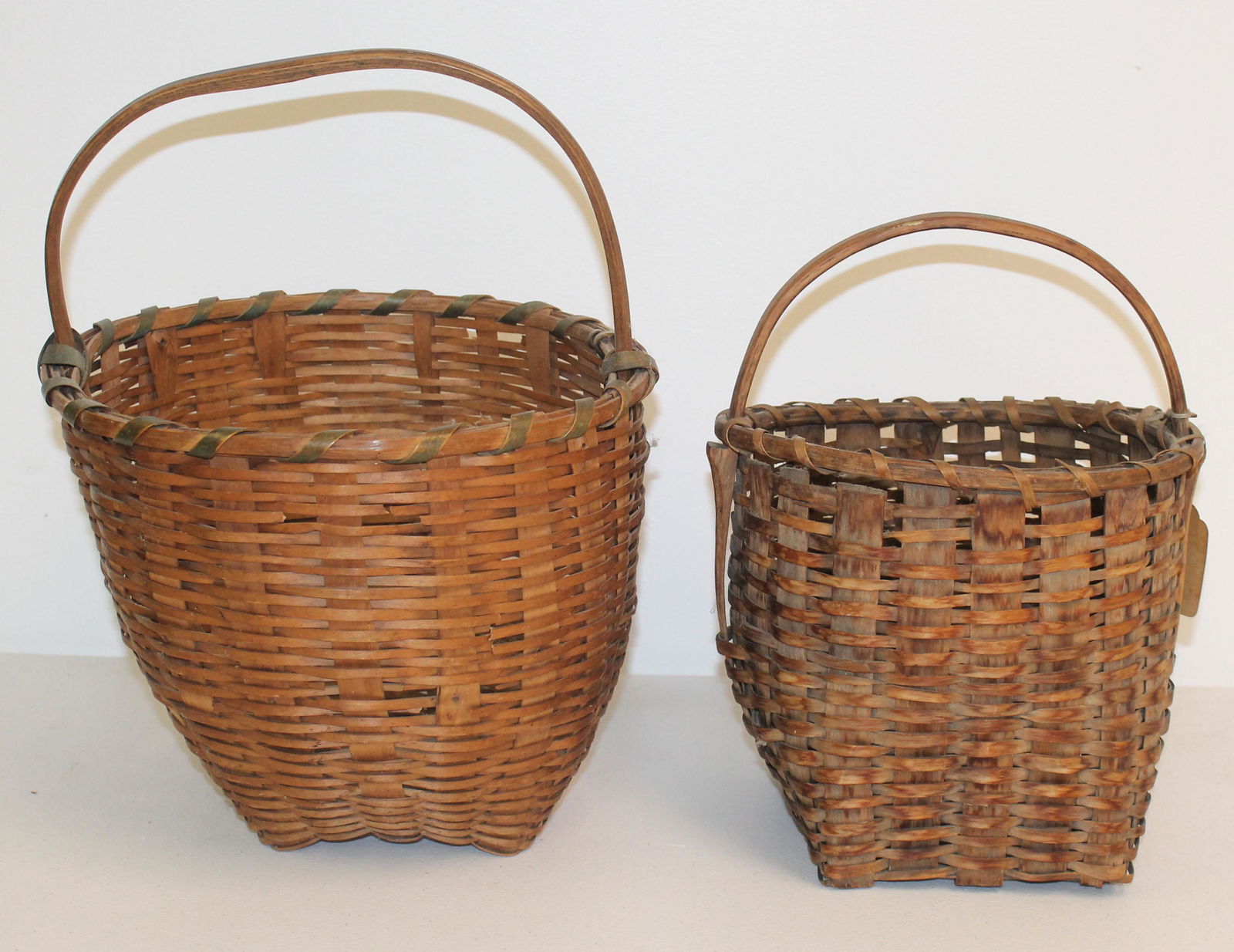 Lot of 2 small baskets w fixed handles - both in as found cond - 10 1/2" x 8 1/4" diam & 13" tall x (1 of 6)