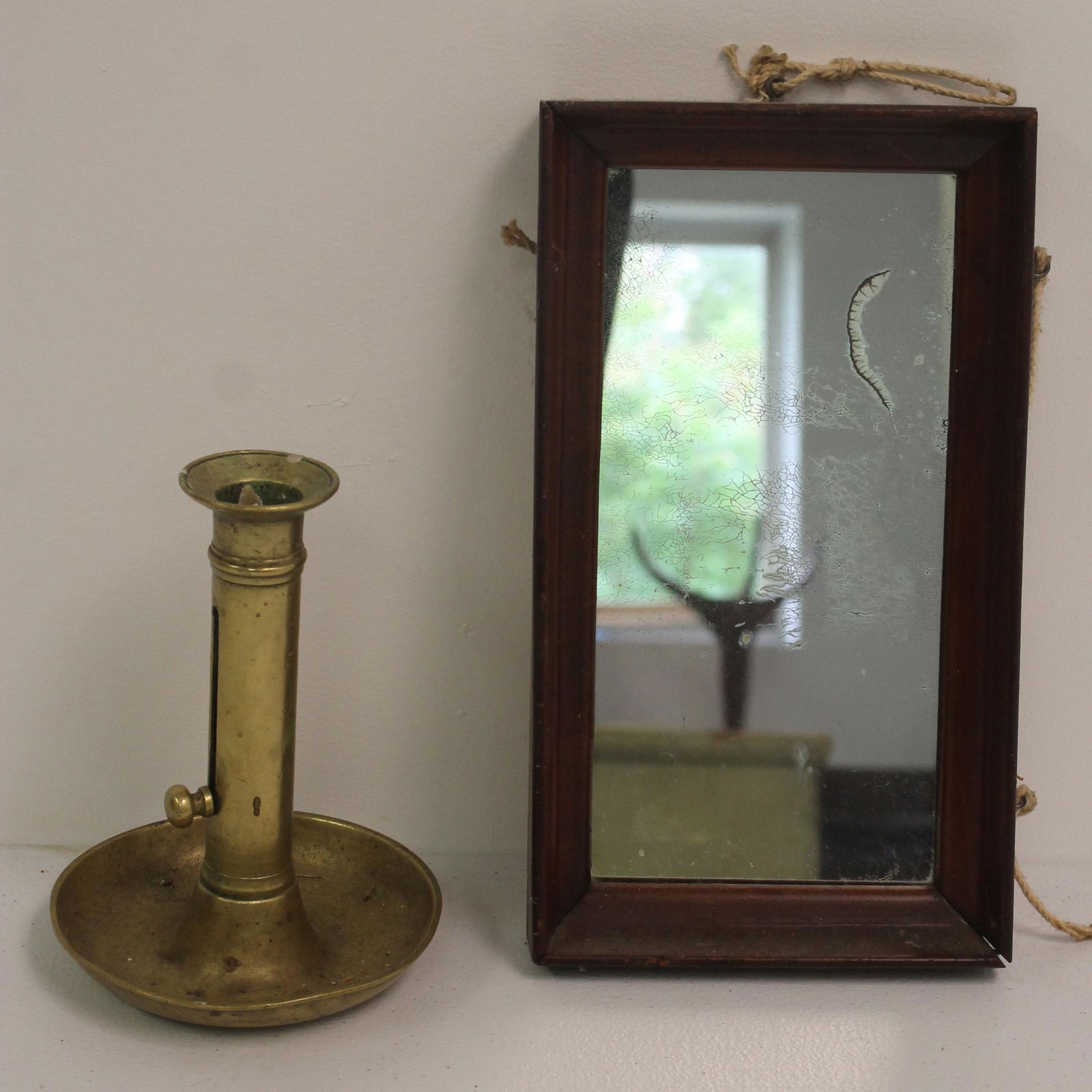 Antique brass candlestick together w a small rectangular courting mirror (1 of 7)