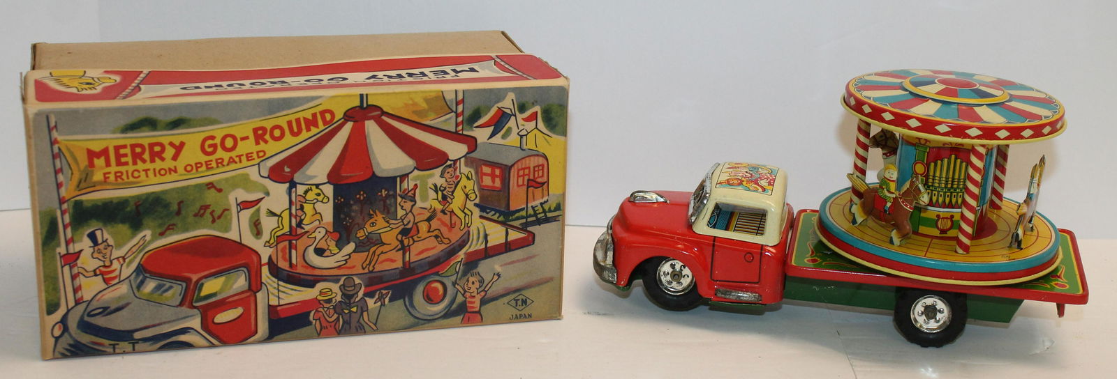 Japanese tin friction "Merry go-Round" in orig box - 8" long toy (1 of 4)