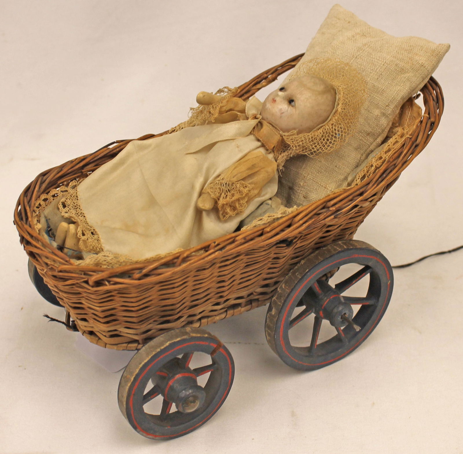 Antique mechanical wax baby doll in wicker carriage w painted wheels - baby is 7" tall - carriage is (1 of 6)