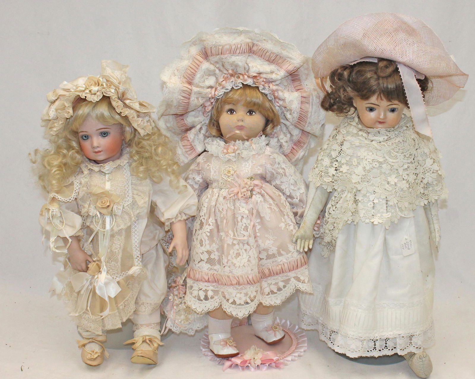 Lot of 3 contemporary dolls incl stocking face & 2 bisque heads: Lot of 3 contemporary dolls incl stocking face & 2 bisque heads