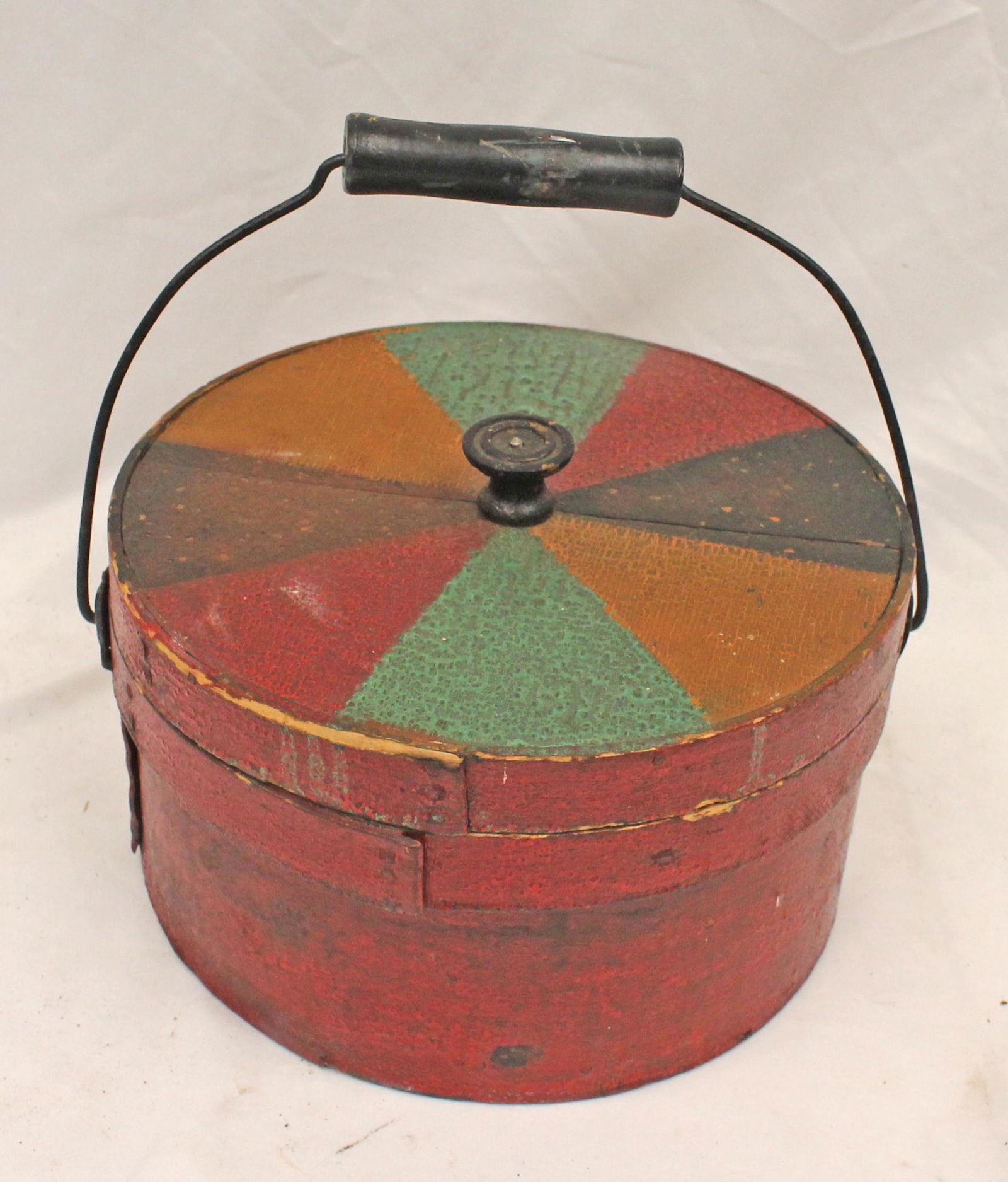 Antique pantry box in red paint w multi color lid w iron bail handle - 5 1/2" tall x 9" diam (1 of 5)