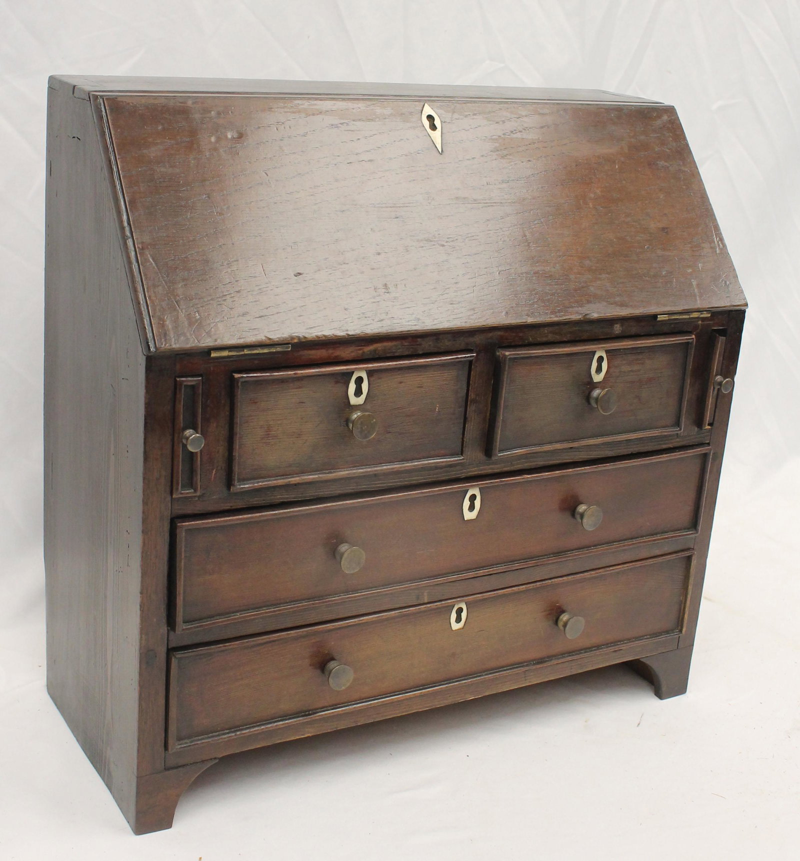 Antique doll size drop front slant lid desk w 2 over 2 drawers, bone escutcheon & old brass knobs -: Antique doll size drop front slant lid desk w 2 over 2 drawers, bone escutcheon & old brass knobs - 15" tall x 15 1/2" wide x 6 3/4" deep