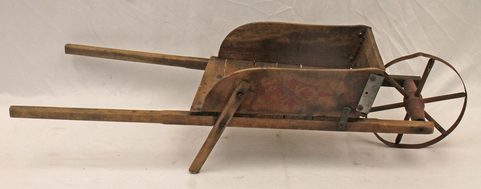 Child size wooden wheelbarrow w iron wheel & red stencilled dec on side - 35" overall length x 13" (1 of 6)