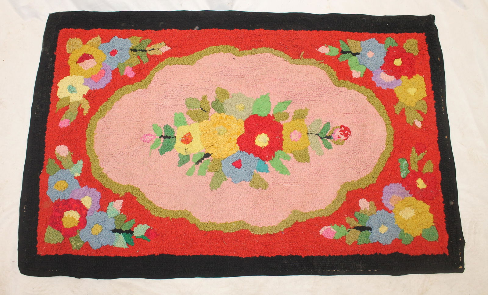 Hooked rug w multi-color floral dec w red background & black border - 27 1/2" x 43 1/4" (1 of 7)