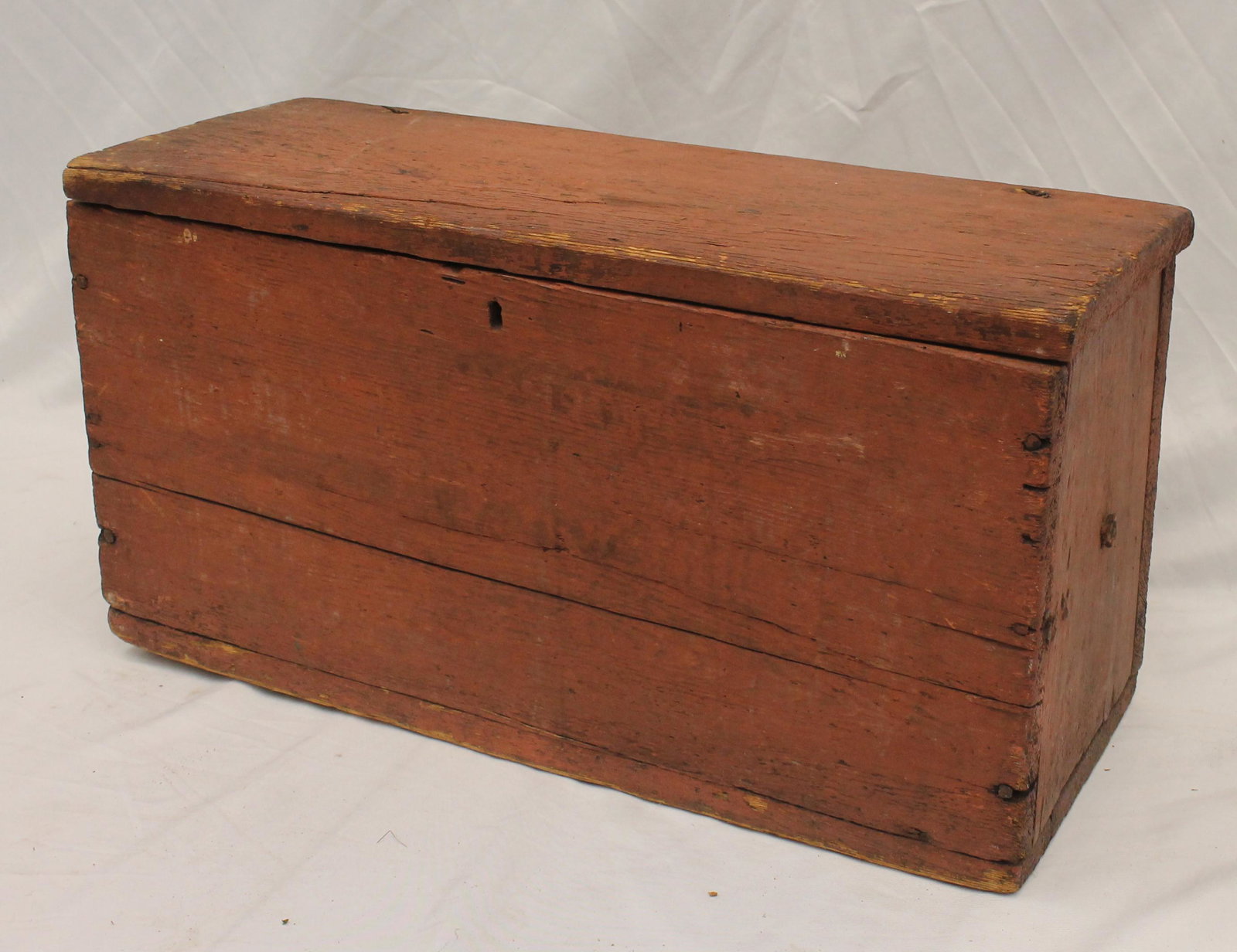 Antique small canted seachest in red paint - 13" tall x 24 1/2" wide x 9 1/2" deep: Antique small canted seachest in red paint - 13" tall x 24 1/2" wide x 9 1/2" deep