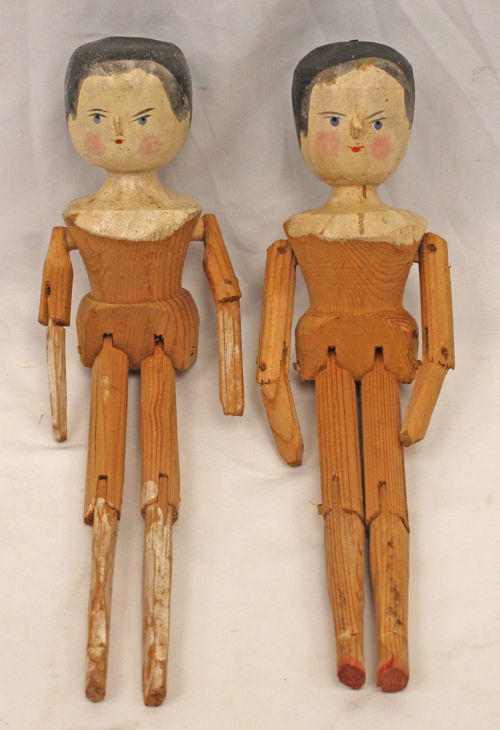 Lot of 2 carved wooden jointed dolls w painted heads & faces - 11" tall: Lot of 2 carved wooden jointed dolls w painted heads & faces - 11" tall
