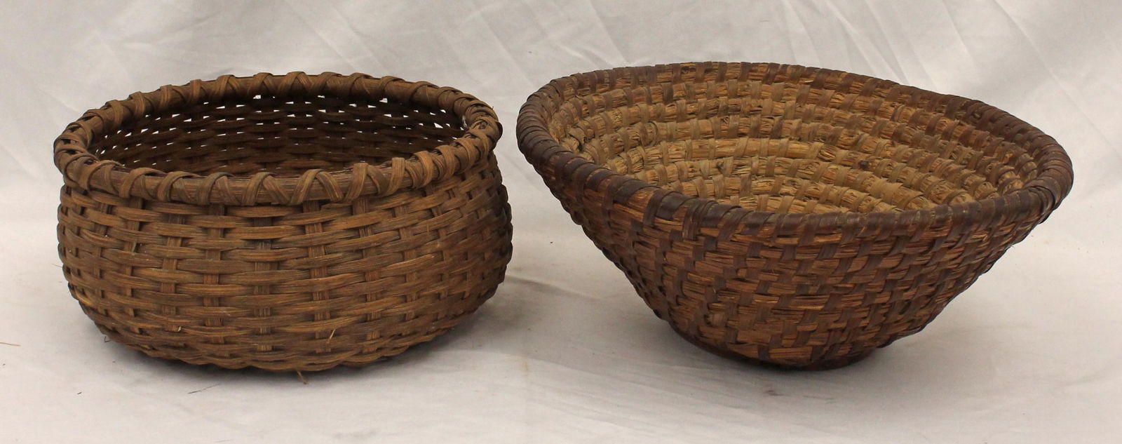 lot of 2 baskets incl 1 rye 5 1/2" tall x 13" diam & 1 splint 4 1/2" tall x 10 1/2" diam (1 of 8)