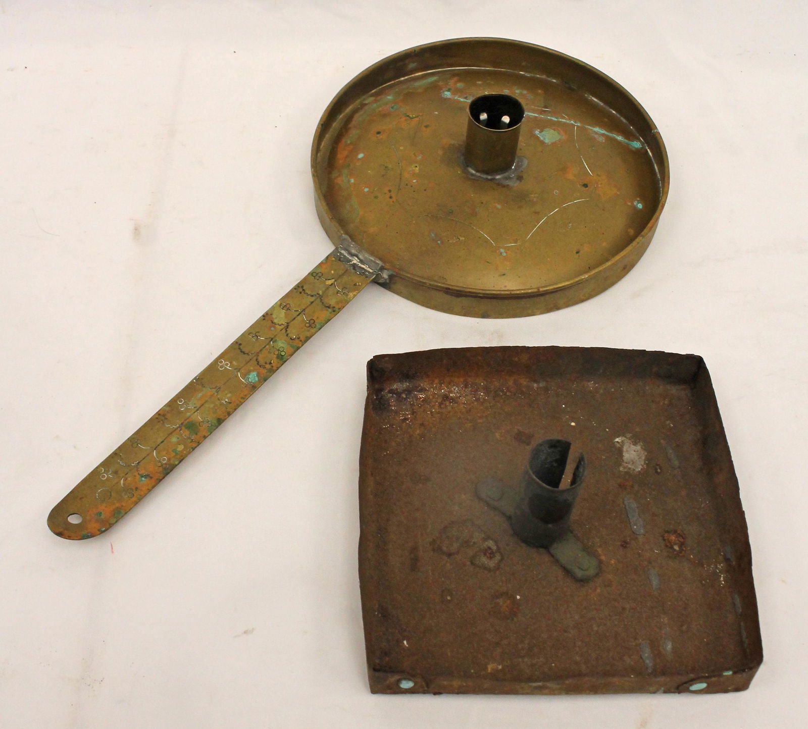Antique lighting lot incl a brass handled candle holder & a tin candle holder (probably part of a (1 of 6)