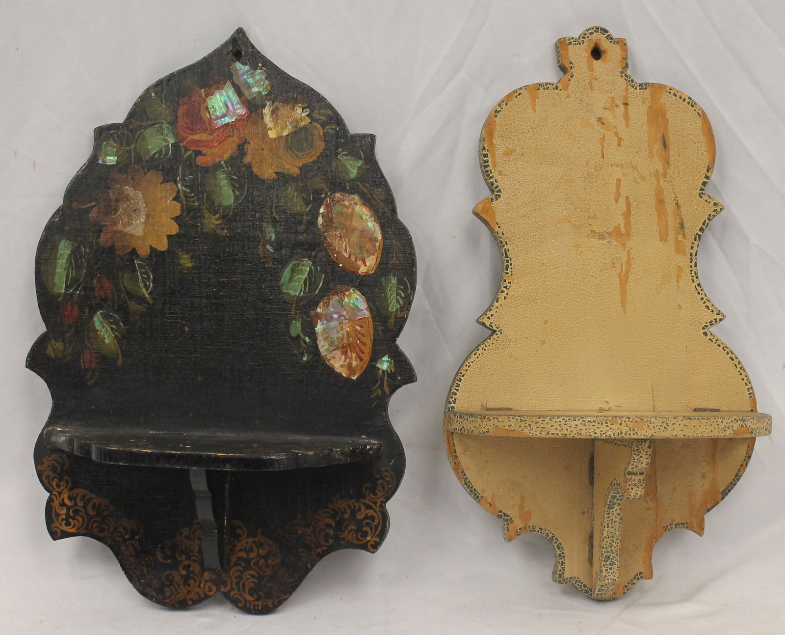 Lot of 2 paint dec wall shelves - 1 in black w abalone dec & the other in alligatored cream w green: Lot of 2 paint dec wall shelves - 1 in black w abalone dec & the other in alligatored cream w green trim dec - black is 17 1/4" tall x 11 1/4" wide & cream is 17 1/4" tall x 9 1/2" wide