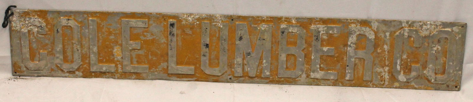 Metal Trade Sign "Cole Lumber Co" w traces of yellow paint - approx 44" wide (1 of 2)