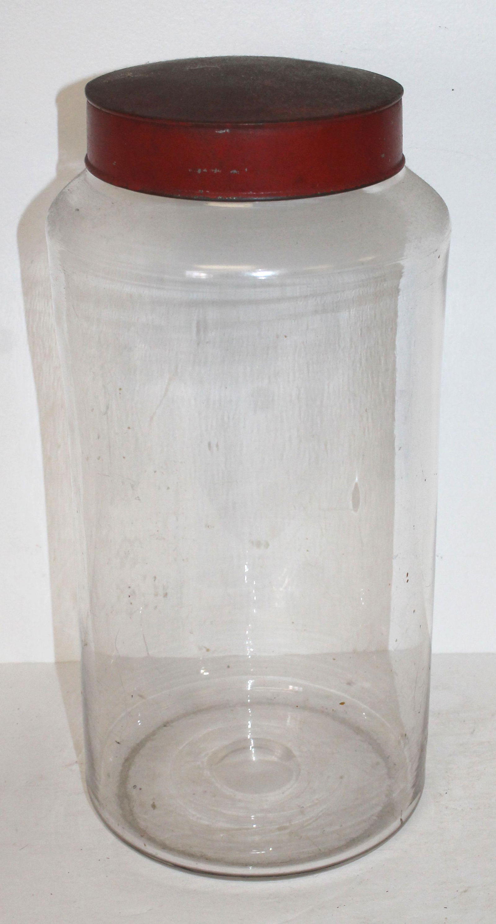 Antique glass apothecary jar w red tin lid - 15" tall (1 of 3)