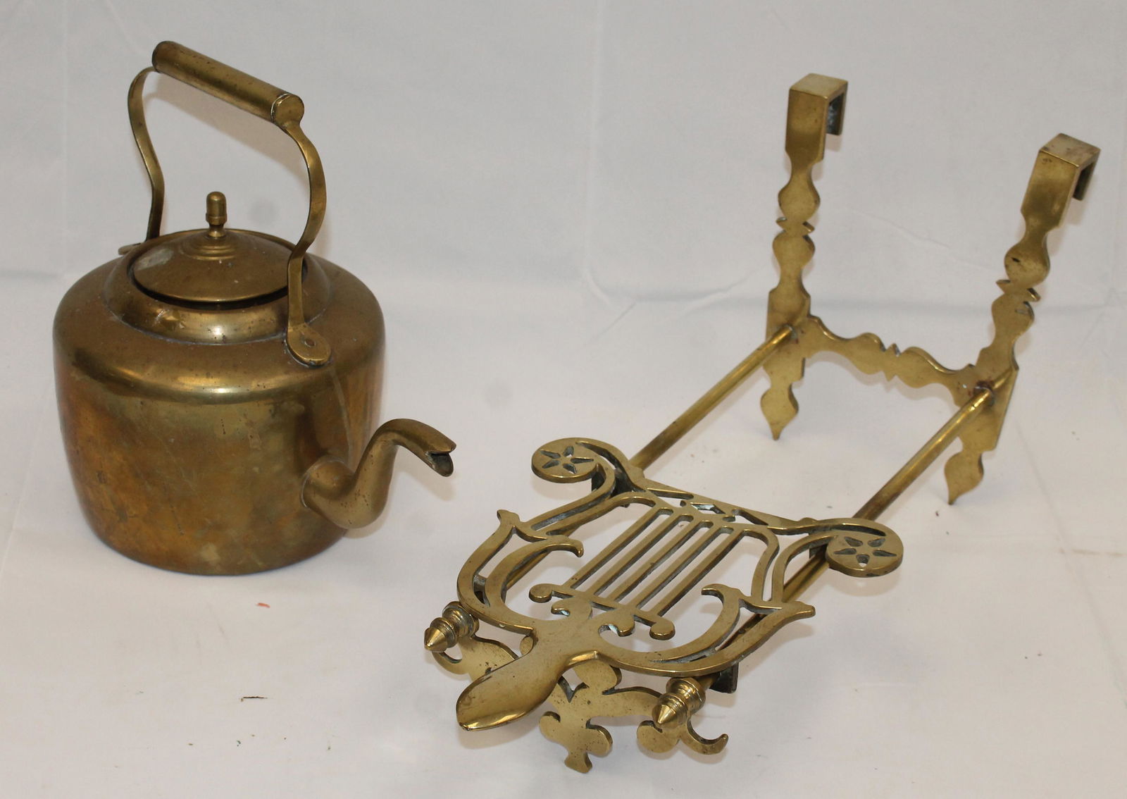 Antique brass kettle on hanging trivet (1 of 3)