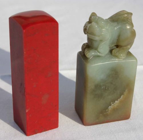 2 small soapstone seals in orig boxes - 2 3/4" - 1: 2 small soapstone seals in orig boxes - 2 3/4" - 1 in red & 1 in green