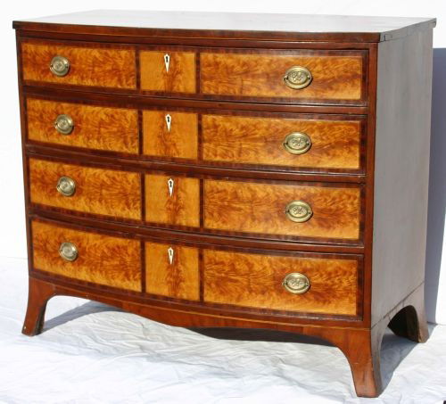 Outstanding form Federal period Portsmouth, NH fla: Outstanding form Federal period Portsmouth, NH flame birch 12 panel 4 dr bowfront chest w period brasses & ivory escutcheons - 38 1/2" wide