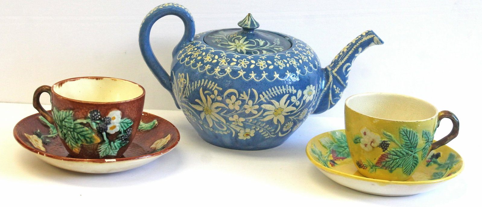 Swiss Majolica teapot by Johann Wazenreid offered with 2 complimenting Majolica cups & saucers -: Swiss Majolica teapot by Johann Wazenreid offered with 2 complimenting Majolica cups & saucers - photographed as October in "The Collectible Teapot" 2024 calendar