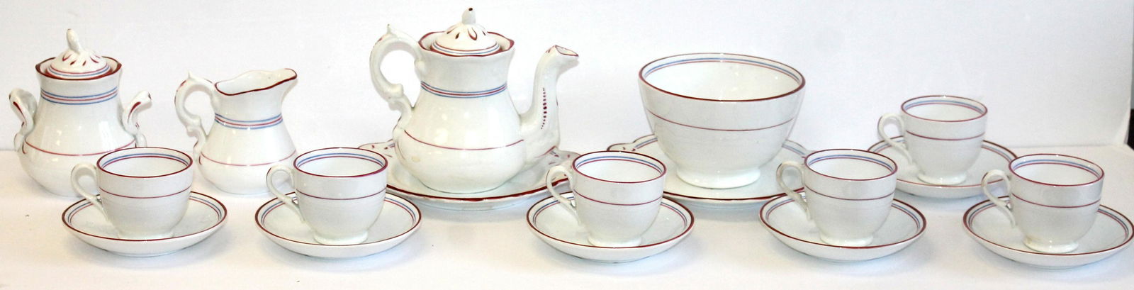 Staffordshire child's tea set w teapot, creamer, sugar, bowl & cups w saucers - photographed as: Staffordshire child's tea set w teapot, creamer, sugar, bowl & cups w saucers - photographed as December in "The Collectible Teapot" 2024 calendar