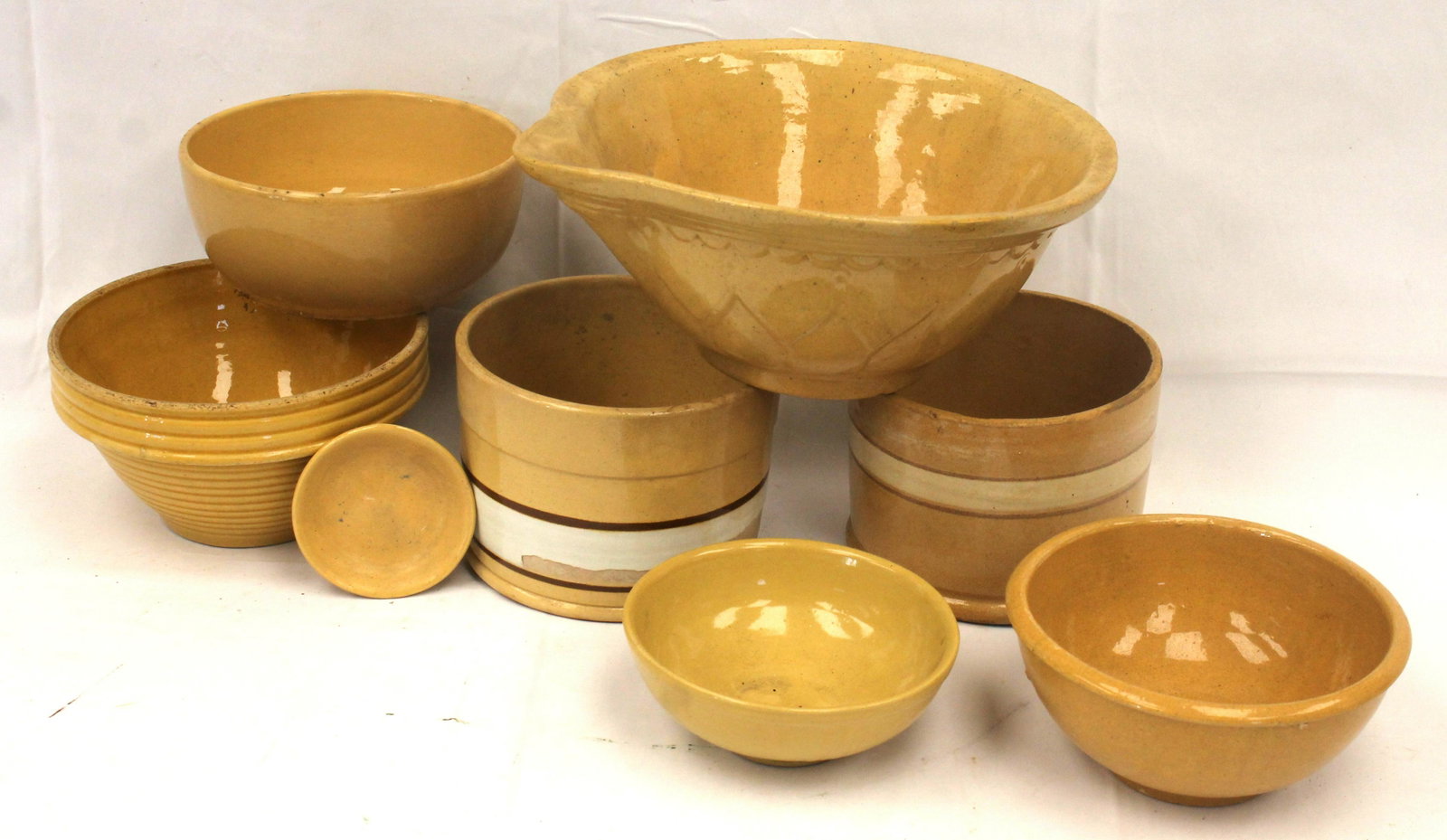 Lot of 8 yellowware items in various shapes & sizes incl a batter bowl, 2 butter crocks & bowls -: Lot of 8 yellowware items in various shapes & sizes incl a batter bowl, 2 butter crocks & bowls - Matthew Mead collection