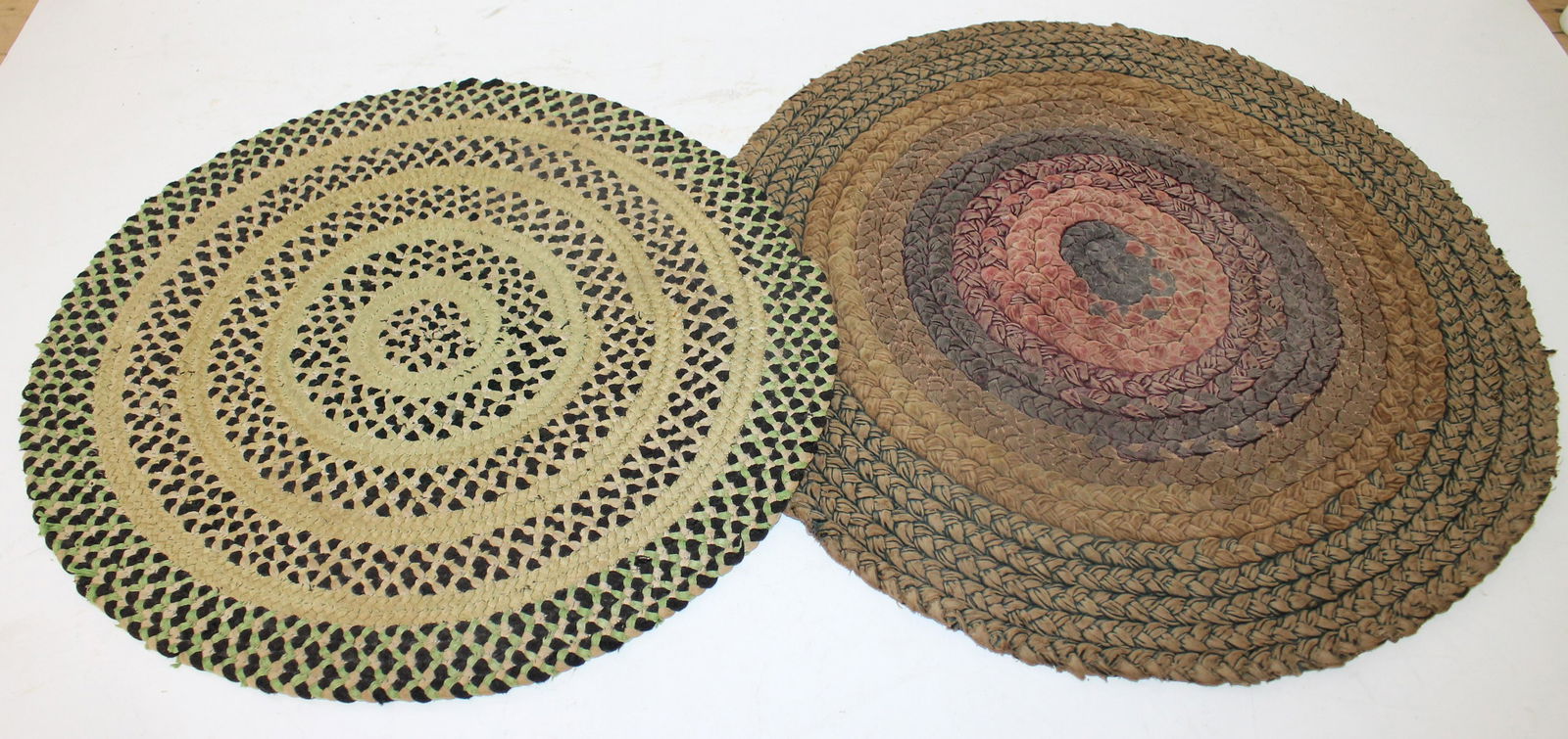 Lot of 2 antique round braided table mats - 18" & 16" diam: Lot of 2 antique round braided table mats - 18" & 16" diam