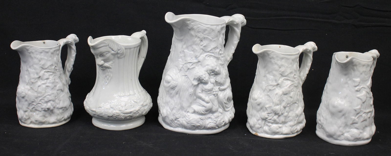 Lot of 5 ironstone pitchers w relief dec incl figural & trees - 7", 5 3/4", 5 1/2" (2) & 5" tall (1 of 16)