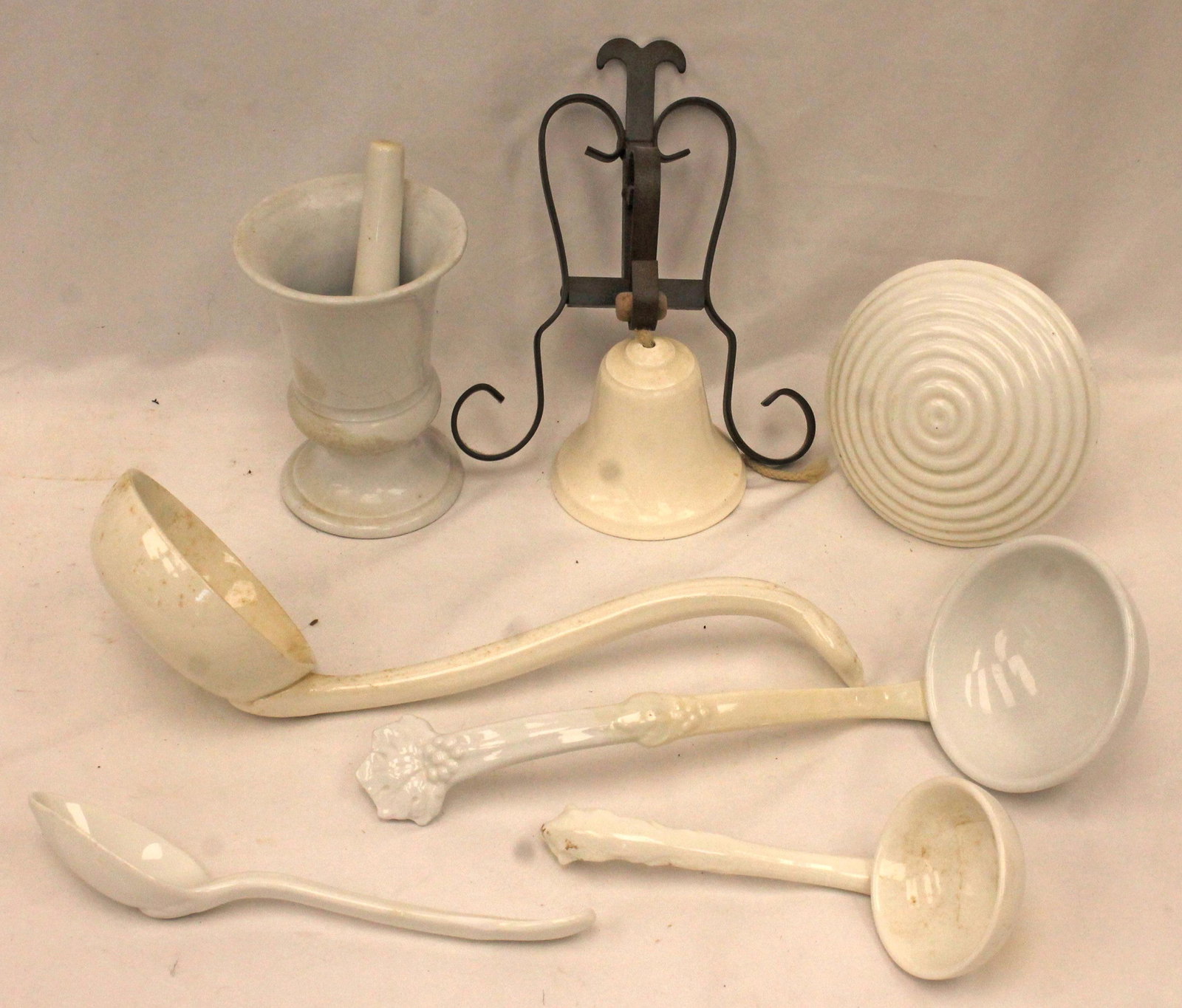 Misc lot of ironstone incl bell, mortar & pestle, ladles, spoon, masher, etc: Misc lot of ironstone incl bell, mortar & pestle, ladles, spoon, masher, etc