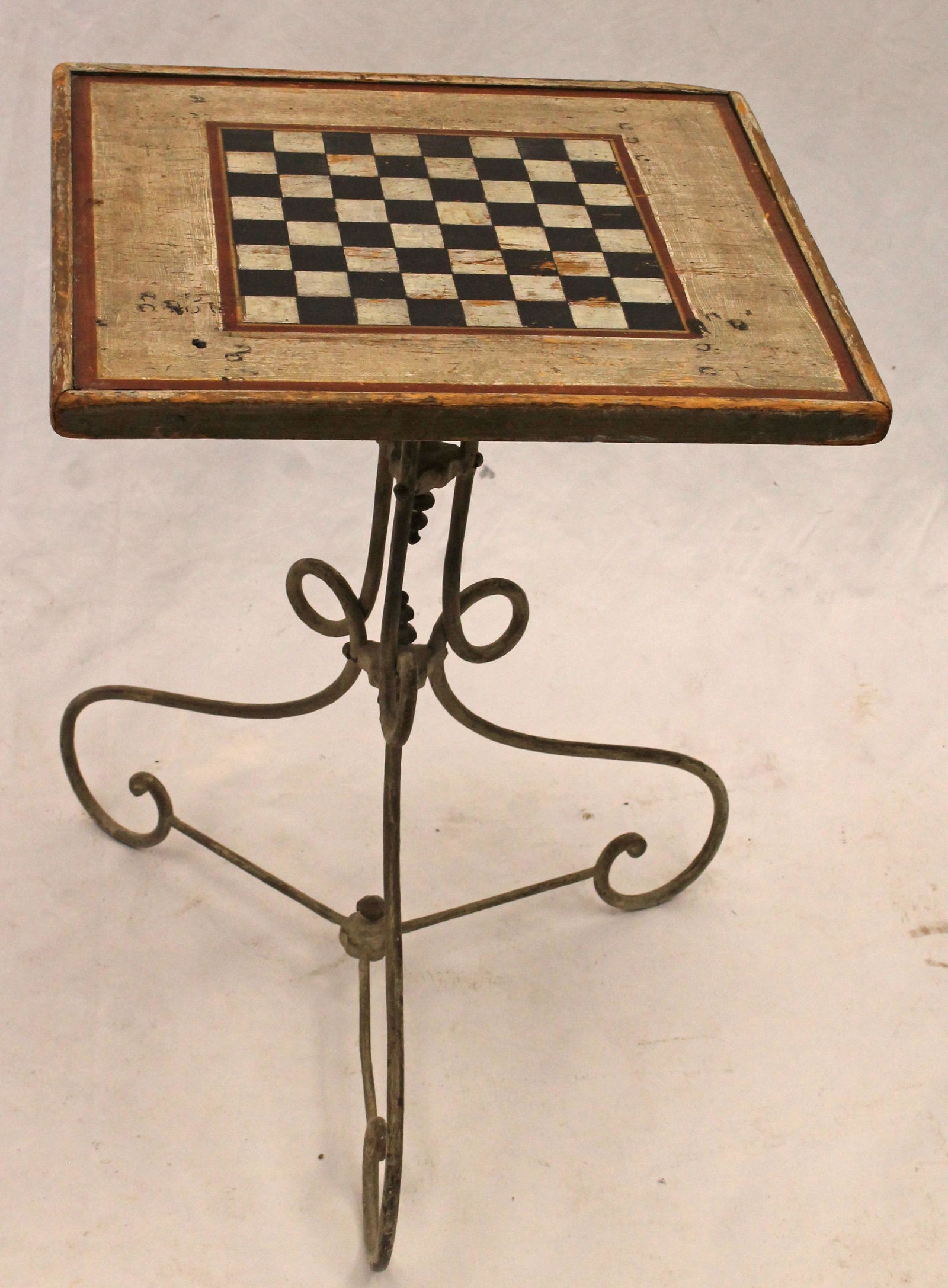 Small game table w iron base & wooden painted checkerboard top - 20" tall x 14 3/4"x13 1/4" (1 of 4)