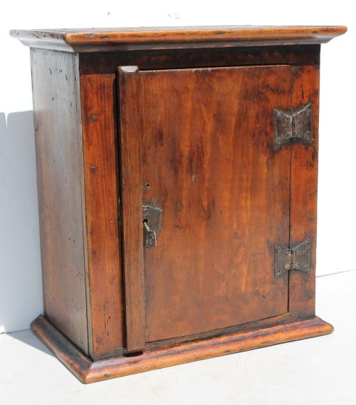 Exceptional late Pilgrim century pine hanging wall: Exceptional late Pilgrim century pine hanging wall or spice cupboard featuring orig butterfly hinges, dovetailed top & bottom, wooden peg construction & orig mustard yellow painted interior - 17" tall
