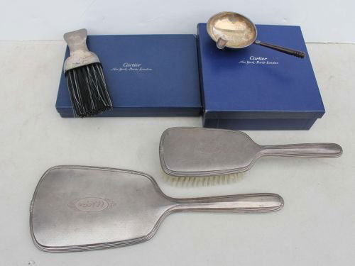 unweighable sterling 4 pc lot orig boxed Cartier i: unweighable sterling 4 pc lot orig boxed Cartier incl ash tray w wooden handle & clothes brush plus a matching hand mirror & hair brush