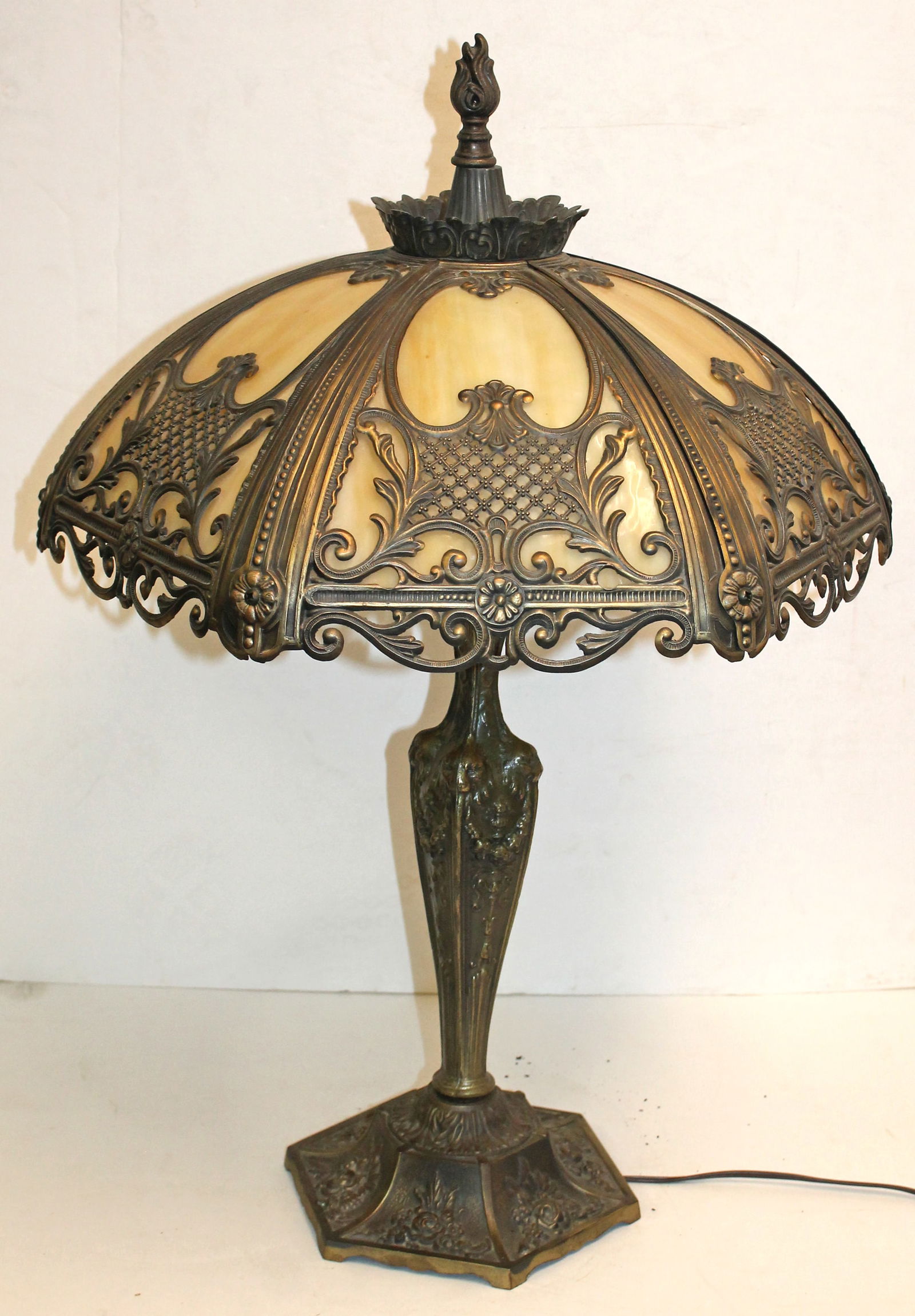 Antique carmel bent slag glass panel lamp w metal overaly on shade on base w lion, floral & wreath (1 of 6)