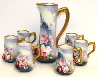 Hand painted Limoges tankard w 6 matching steins/mugs w roses dec & gold painted handles - marked: Hand painted Limoges tankard w 6 matching steins/mugs w roses dec & gold painted handles - marked B&H Limoges France - 2 mugs have chipped rims - 11 1/4" tall tankard & 5" tall mugs