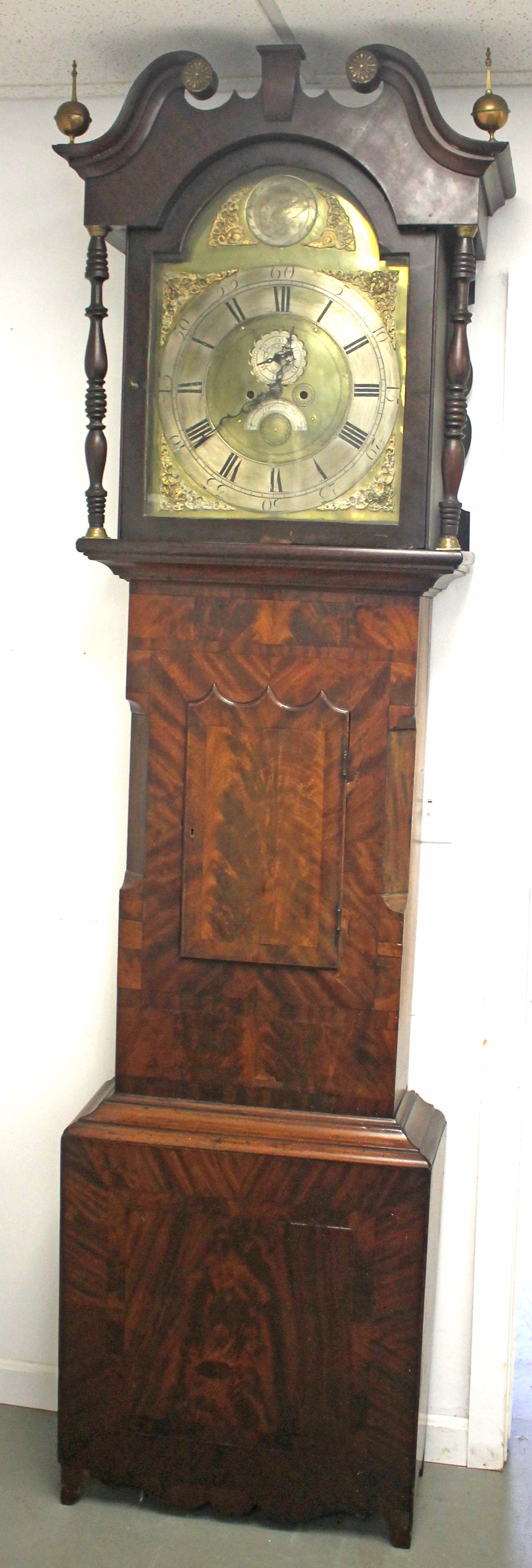Antique mahogany tall clock w 3 brass finials, works & face w windblower decorated corners & marked (1 of 11)