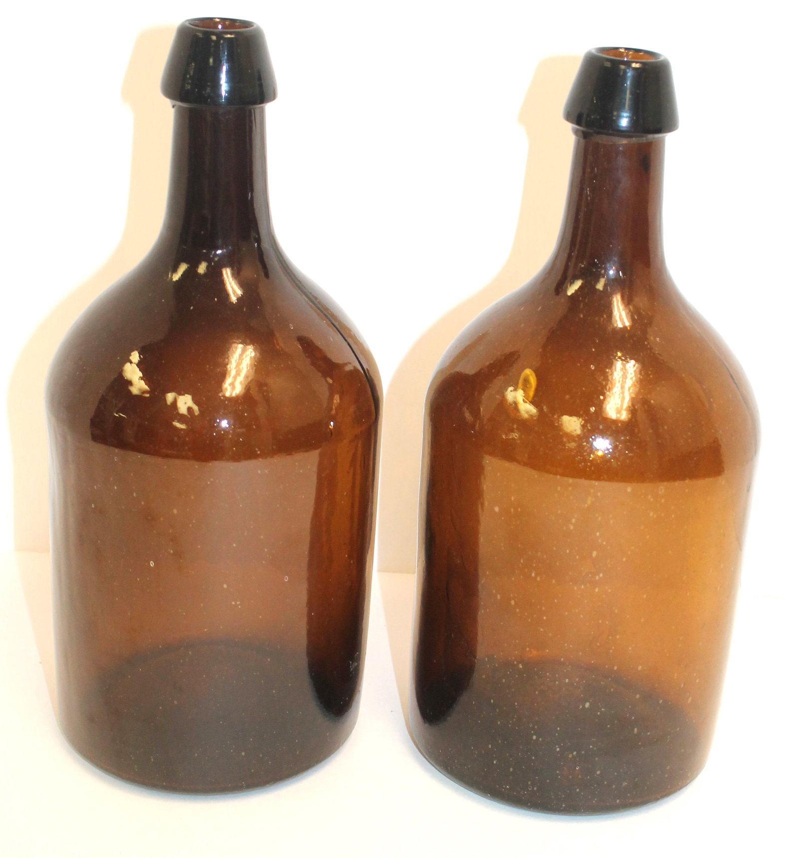 Lot of 2 Stoddard demijohns in old amber & 1 w smooth base - 11 1/2" tall: Lot of 2 Stoddard demijohns in old amber & 1 w smooth base - 11 1/2" tall
