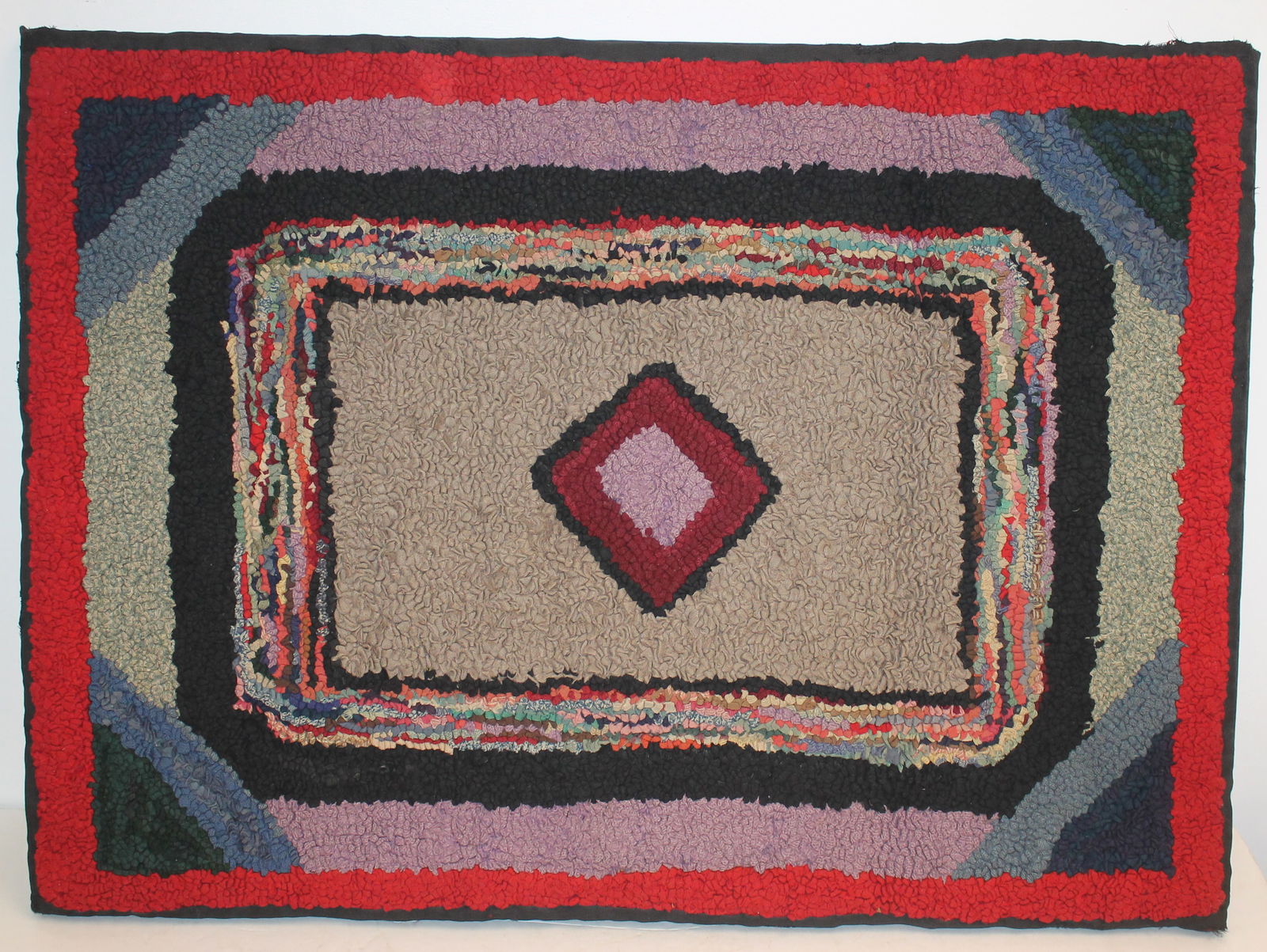 ca 1920-30 Indiana Amish hooked rug of a purple & deep red diamond set in a grey rectangle - mounted (1 of 6)