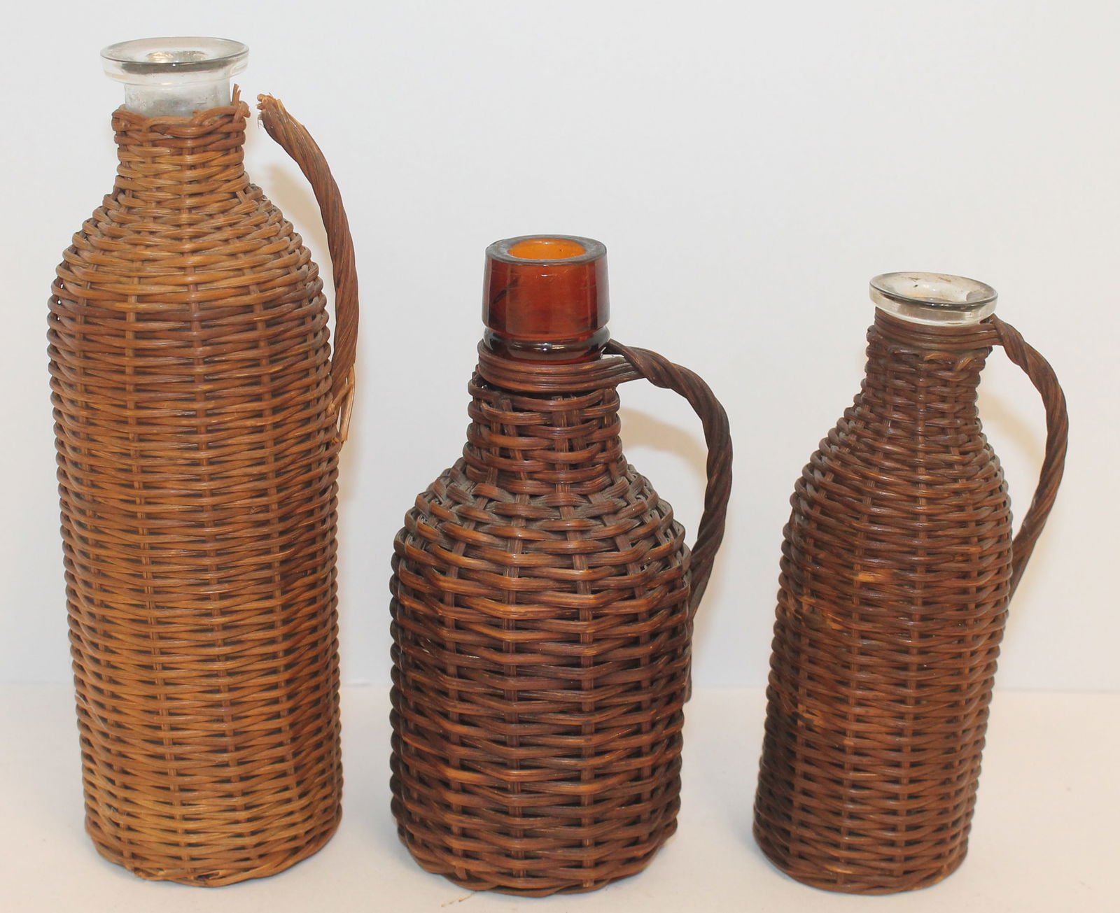 Lot of 3 small wickered bottles - 6 1/2", 5 1/4" & 4 3/4" tall (1 of 9)