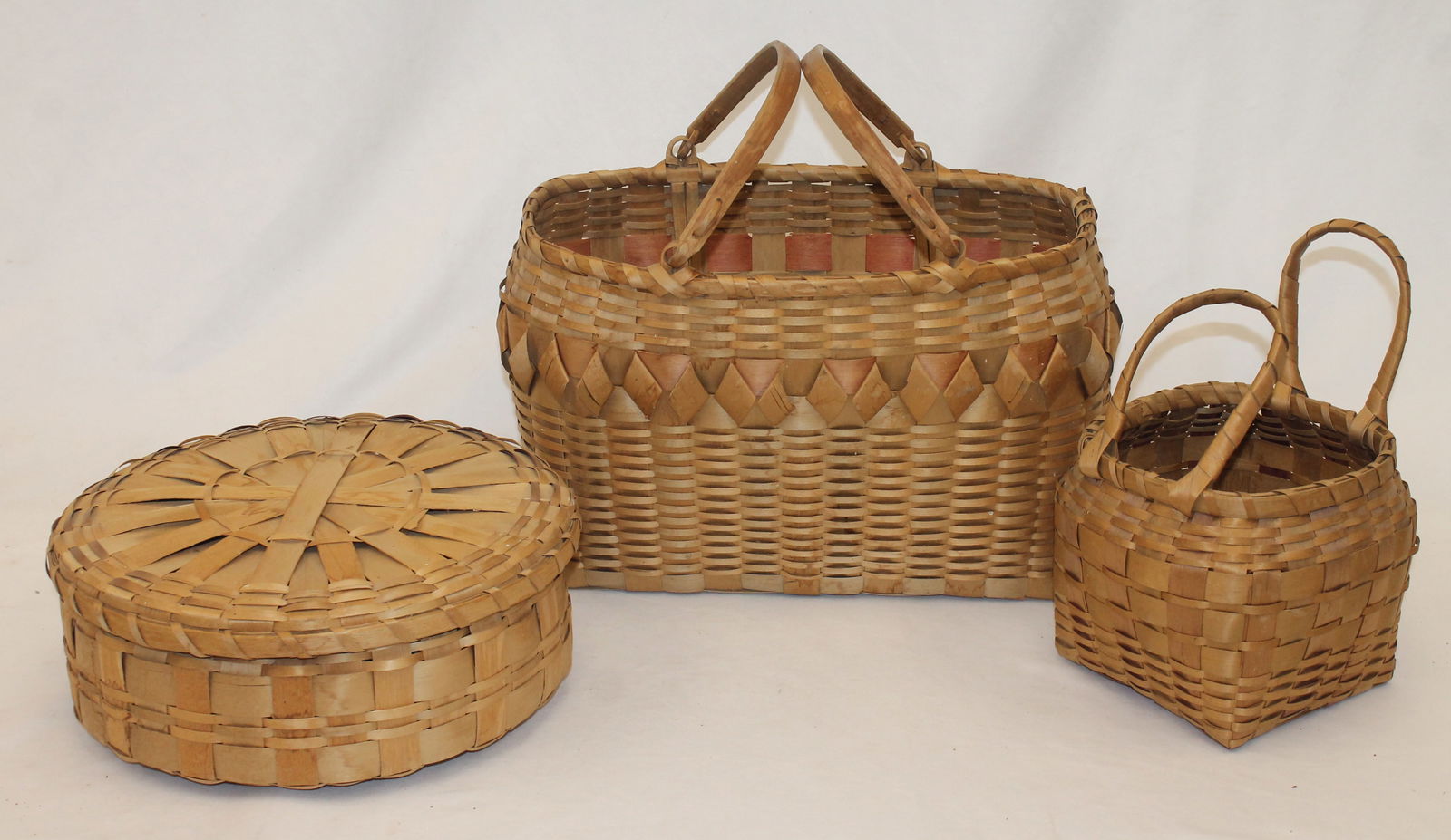 Lot of 3 vintage baskets incl round covered, a large dbl swing handled & a small dbl fixed handled - (1 of 4)
