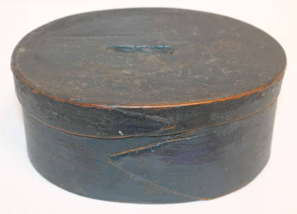 Antique oval finger lapped pantry box in blue paint - lid had slot cut in to make it a bank but has: Antique oval finger lapped pantry box in blue paint - lid had slot cut in to make it a bank but has an old leather tacked make-do repair on inside of lid to close slot - 6 1/4"x4 3/4"