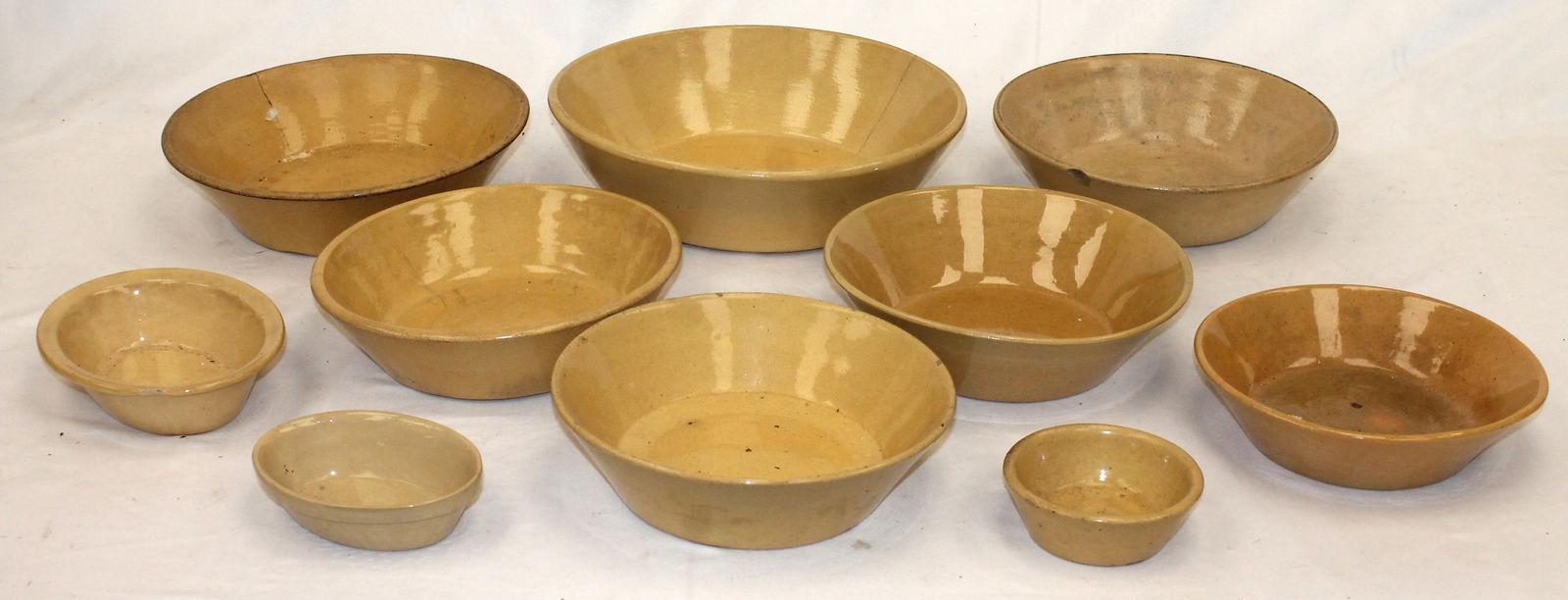 Lot of 10 yellowware milk pans, pudding cups, & molds in various sizes - smallest is 4 1/2" & (1 of 13)