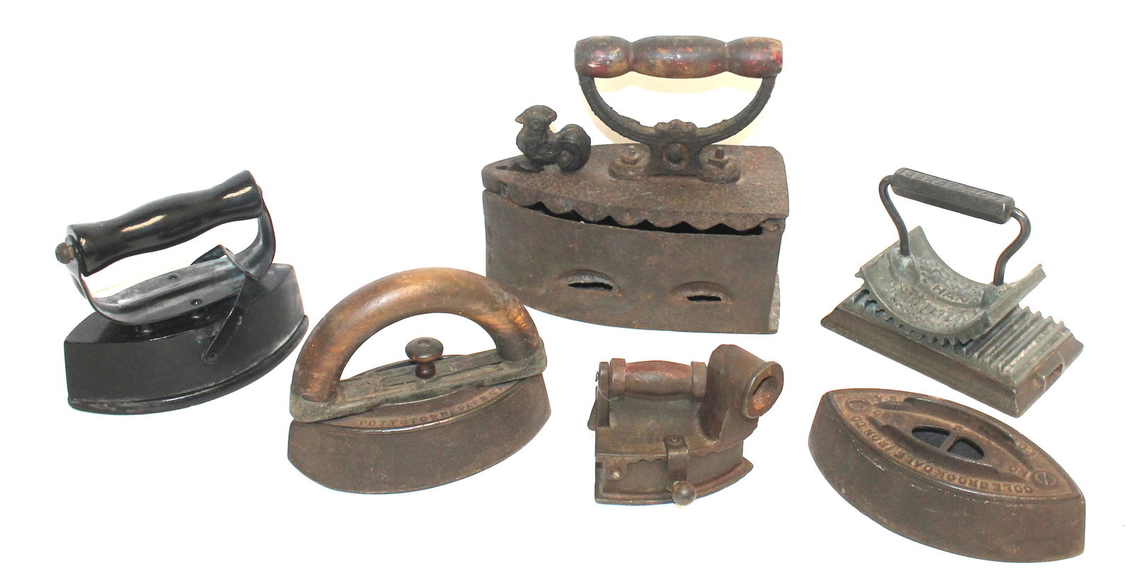 Lot of 5 antique sad irons in a variety of forms & sizes plus an iron crimper (1 of 9)